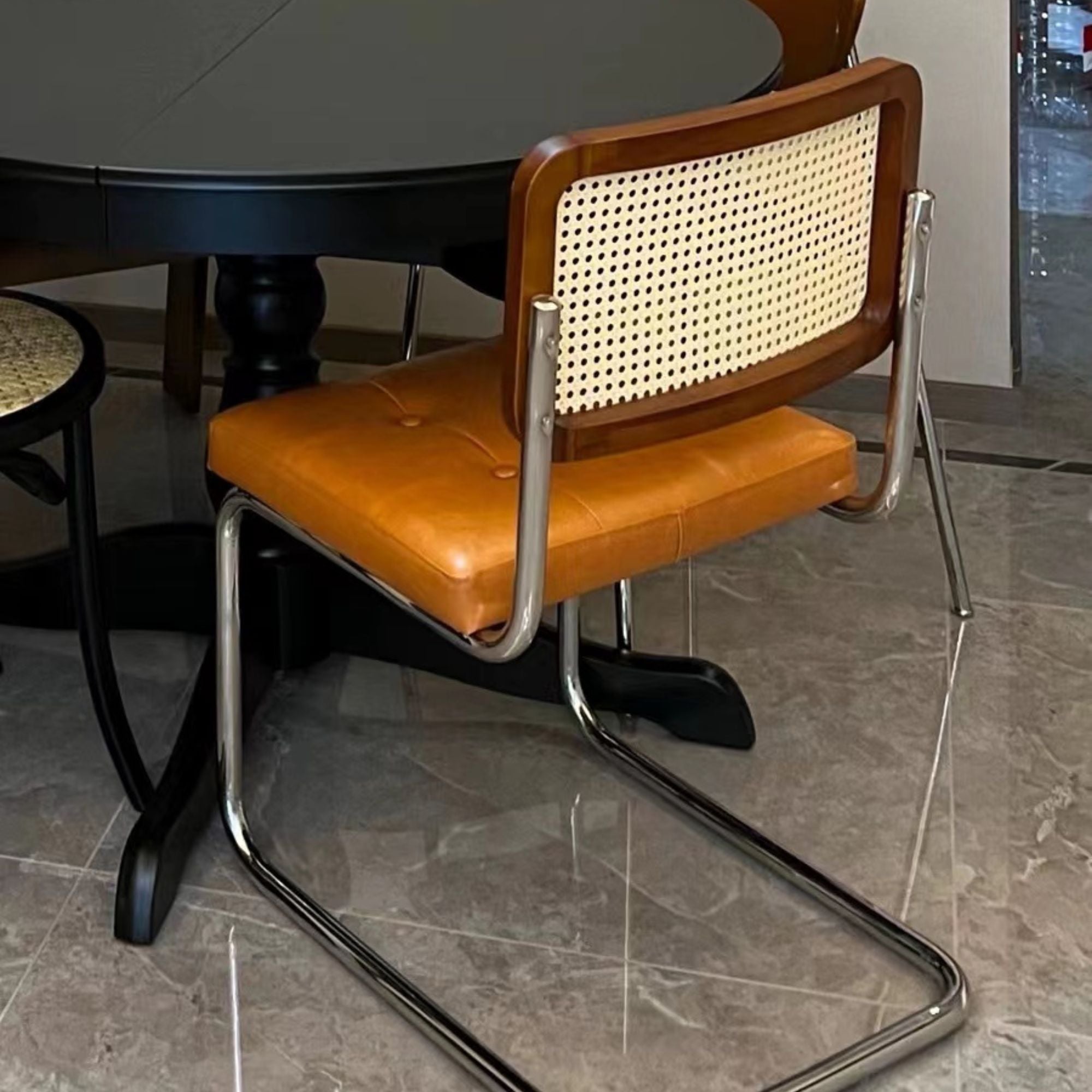 Backview of Zephyr stainless steel chair in real homes