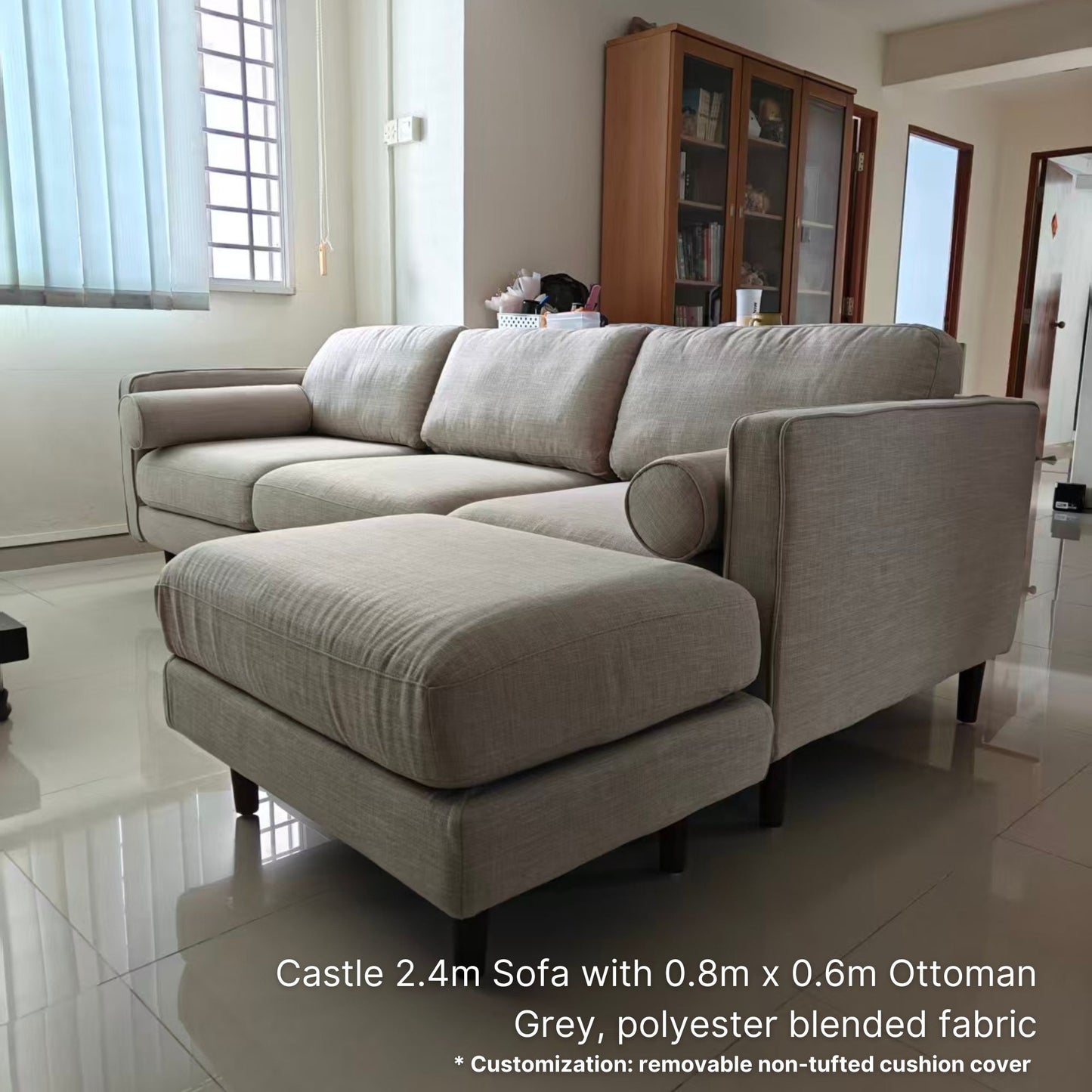 Gray sofa with ottoman in a living room setting