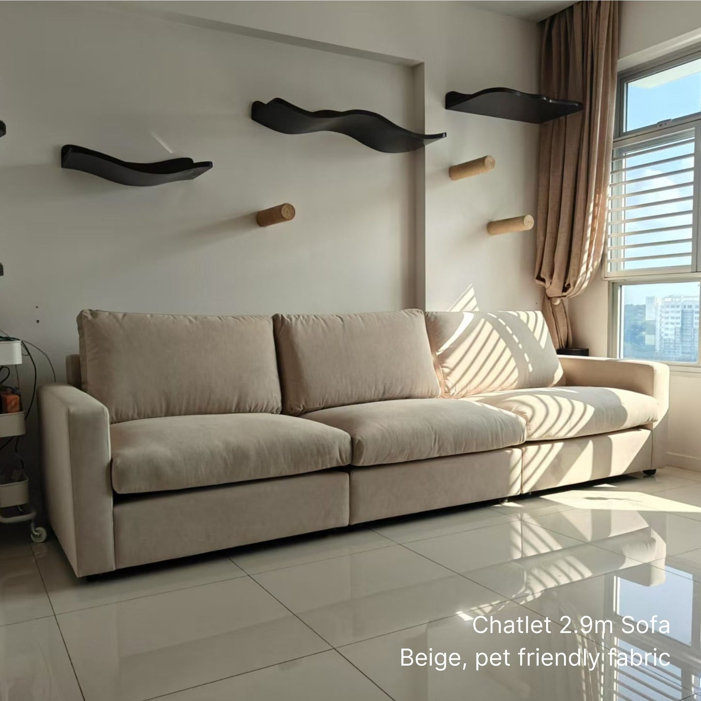 Beige pet friendly fabric 4 seater 290cm Chalet sofa in a room with wall-mounted cat shelves and a window.