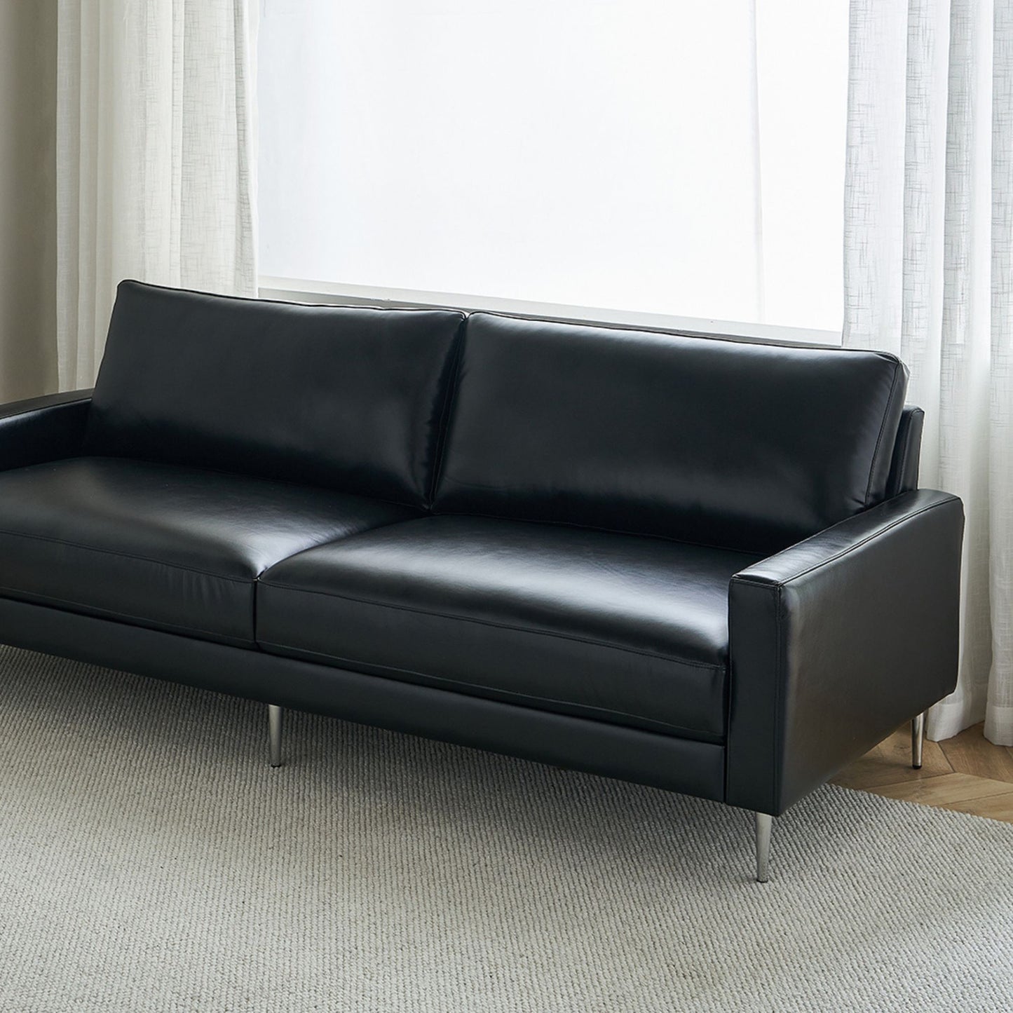Coach faux leather sofa black
