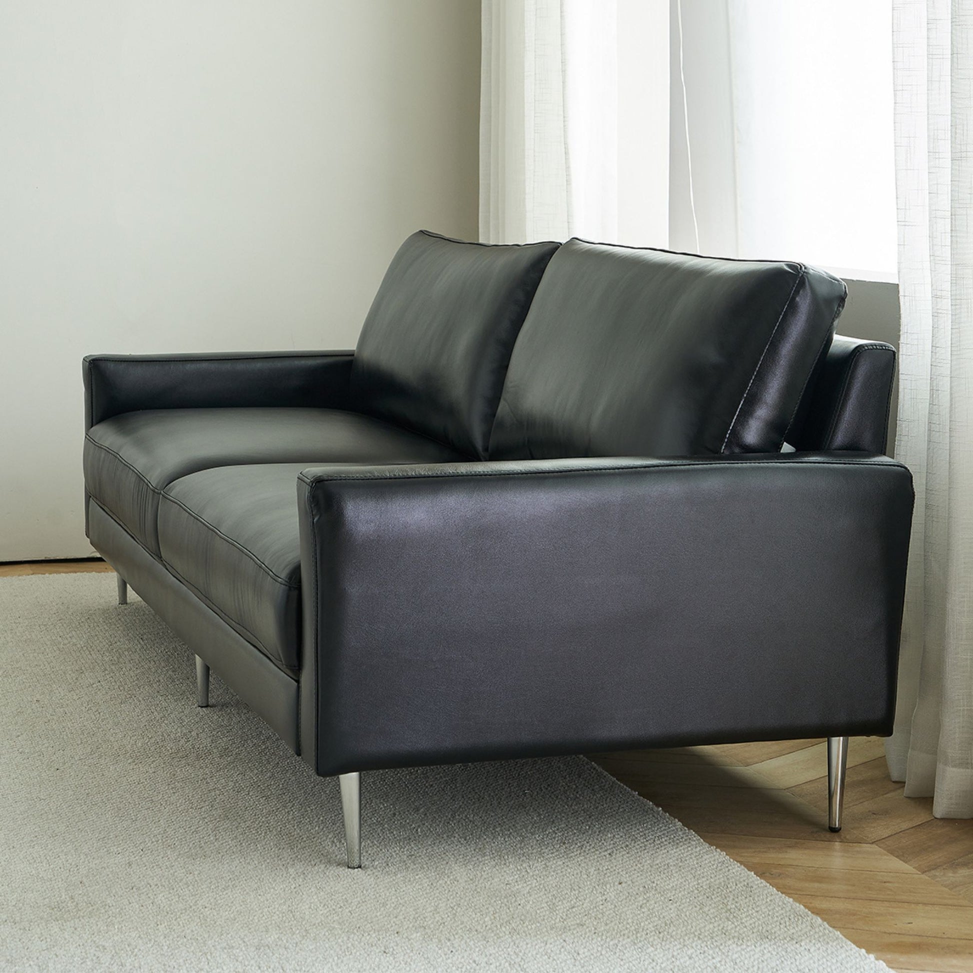 Coach faux leather sofa black