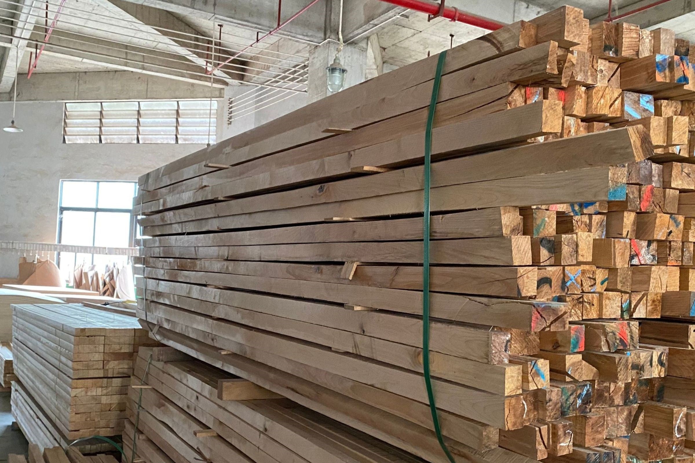 Sofa factory showing solid larch wood stockpile