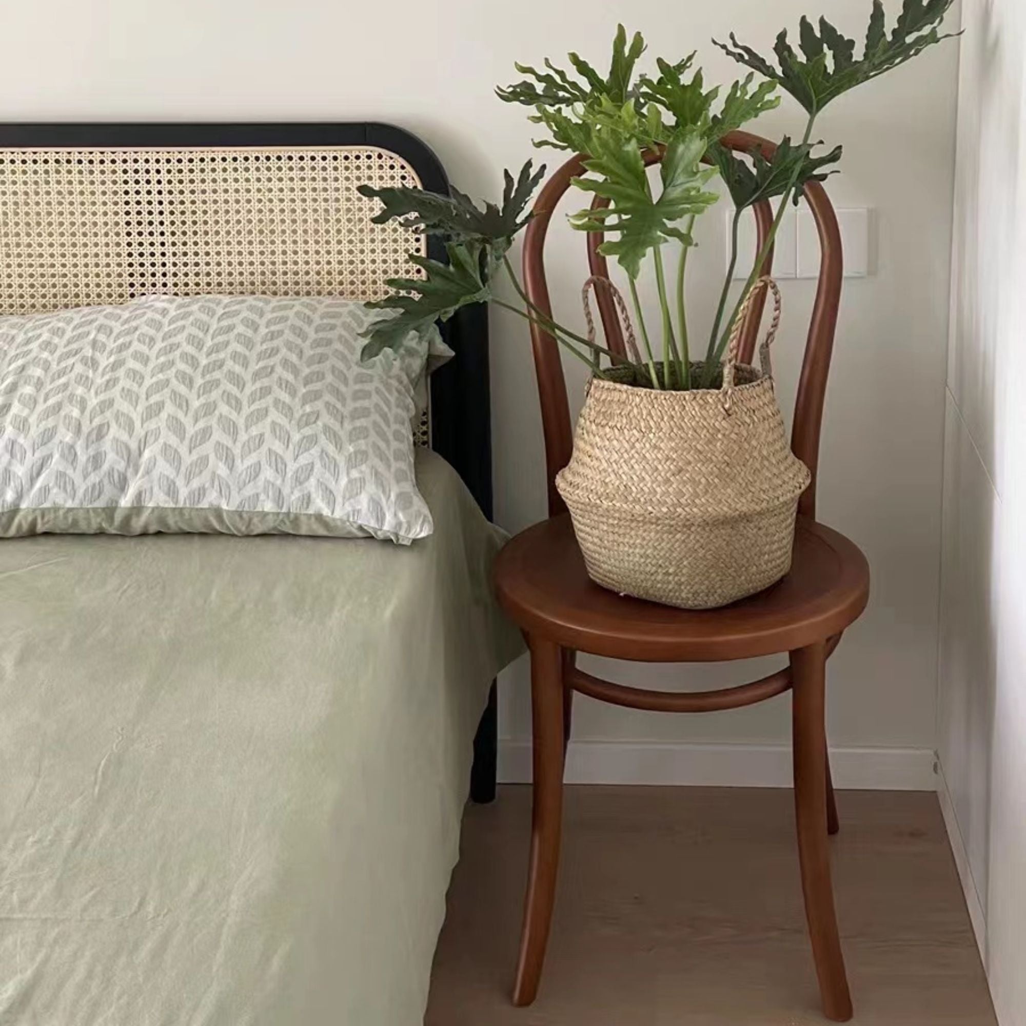 Teddy beech wood chair placed next to bed