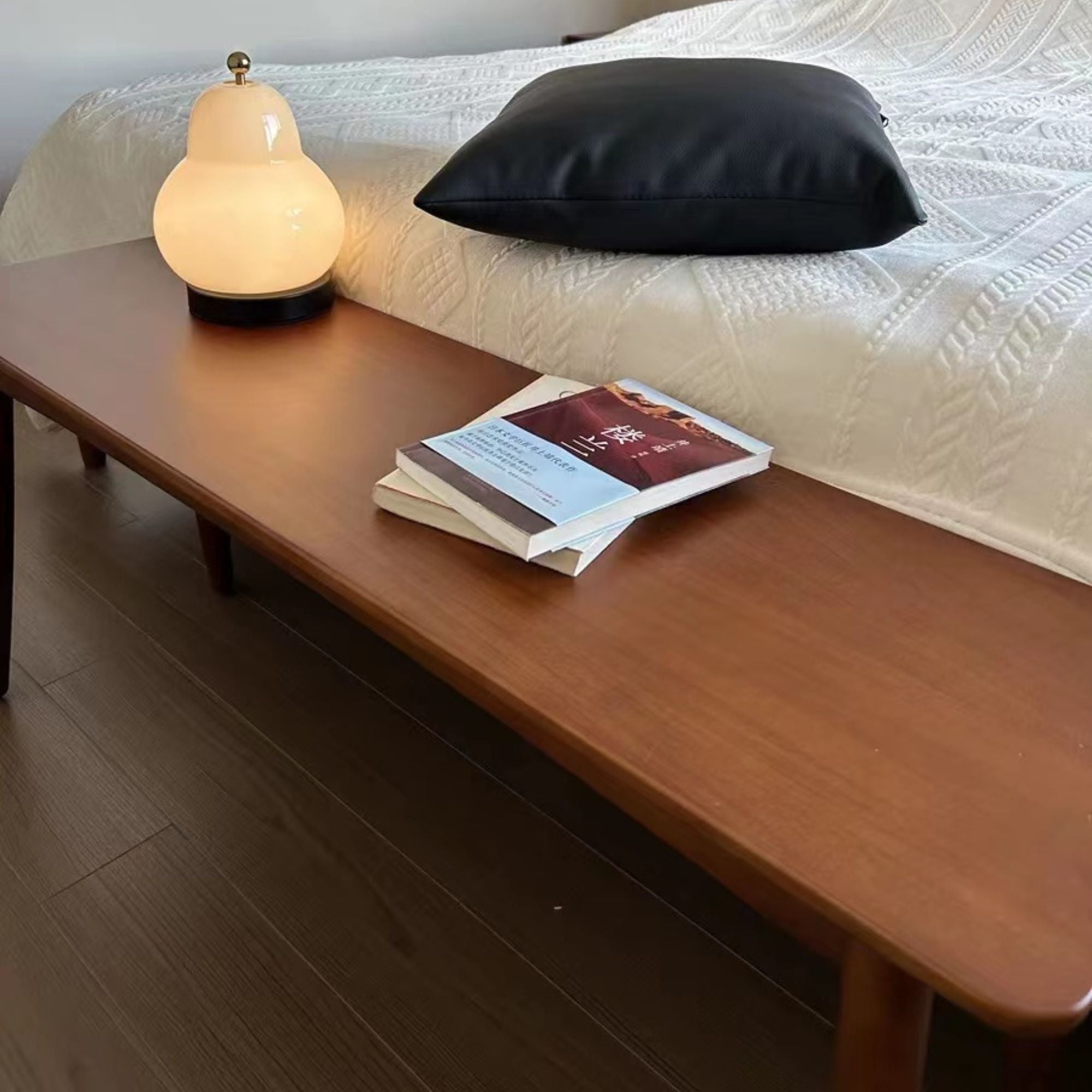 Tranquil wood bench by bed