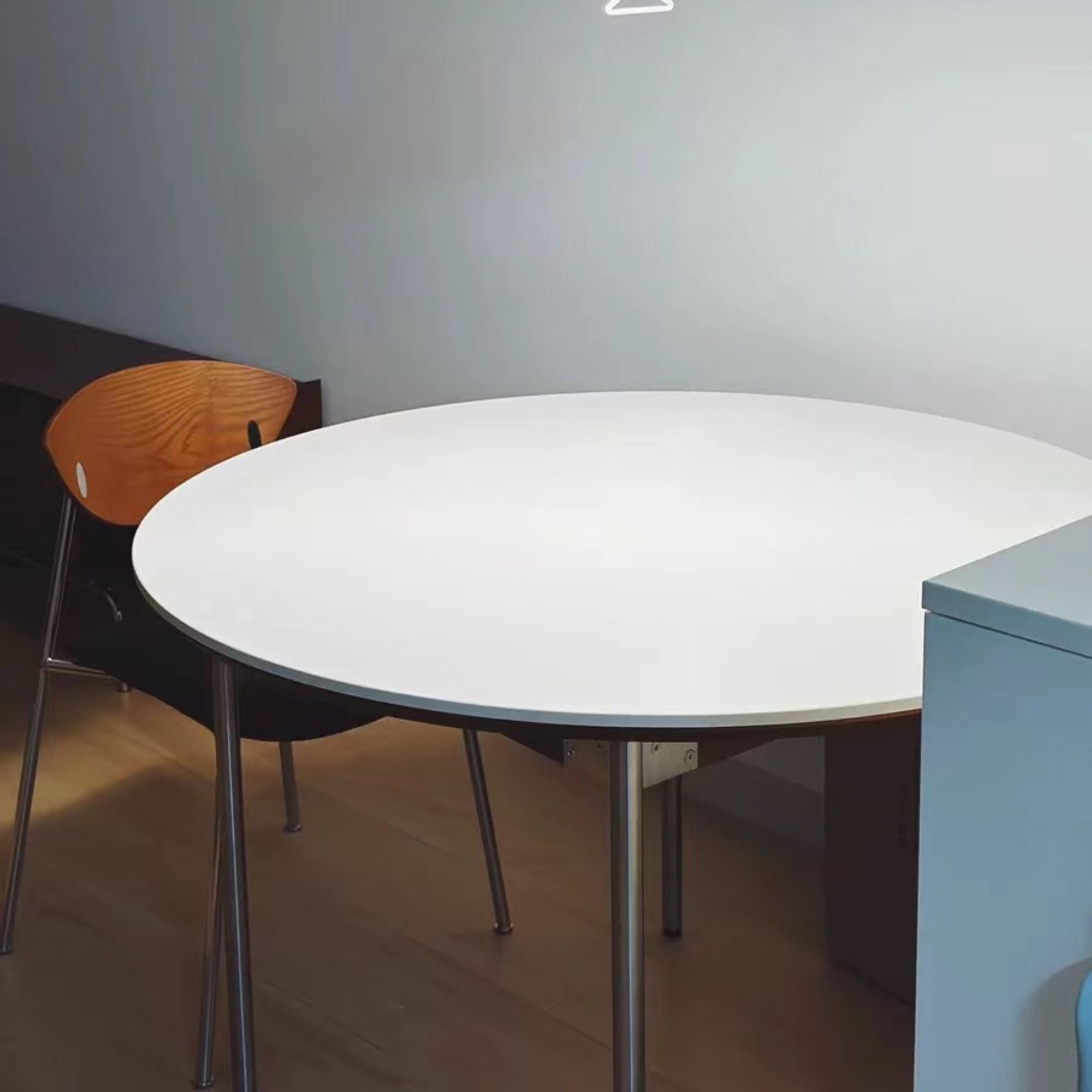 Tyra stainless steel chair as part of round table dining set