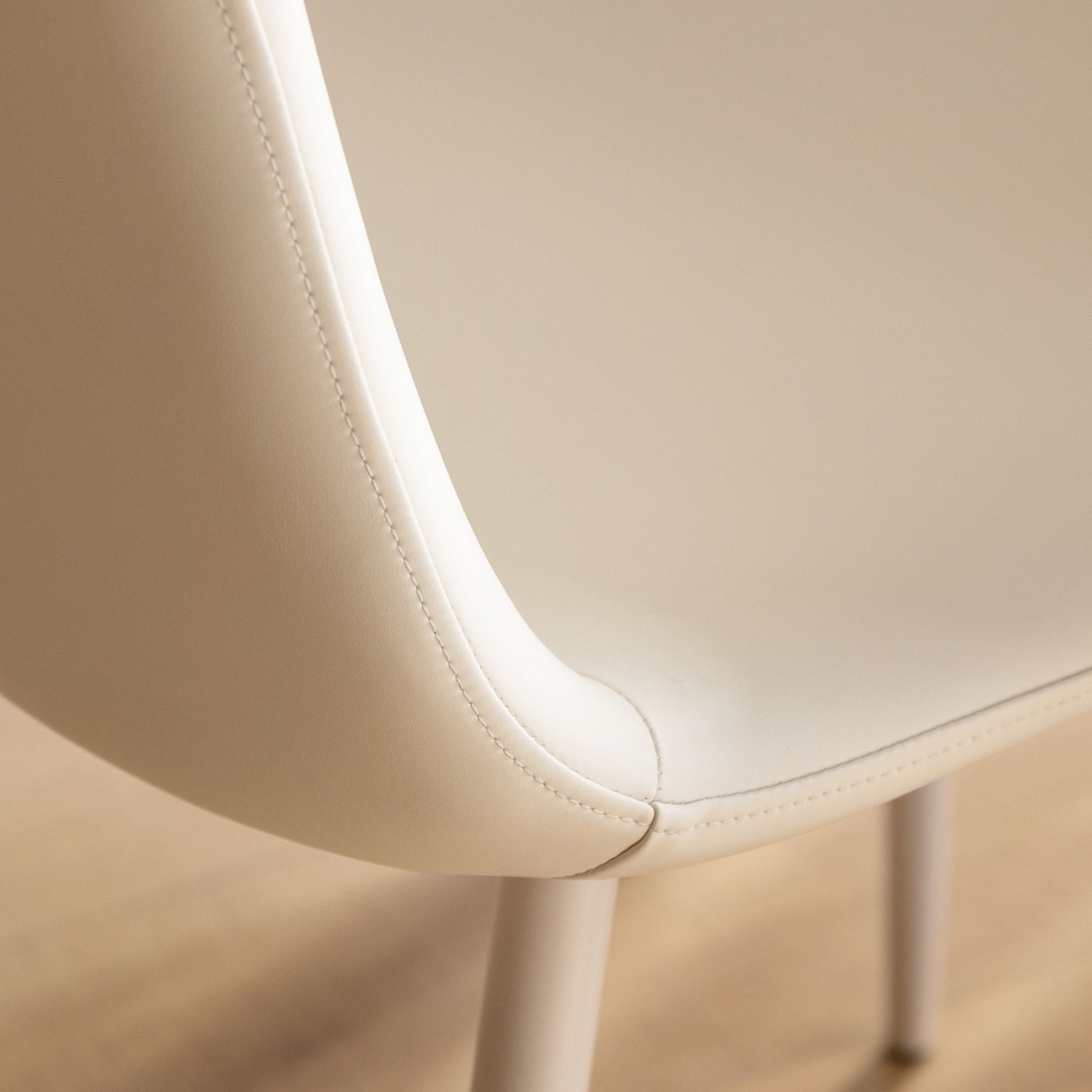 Close-up of a white chair with a blurred background