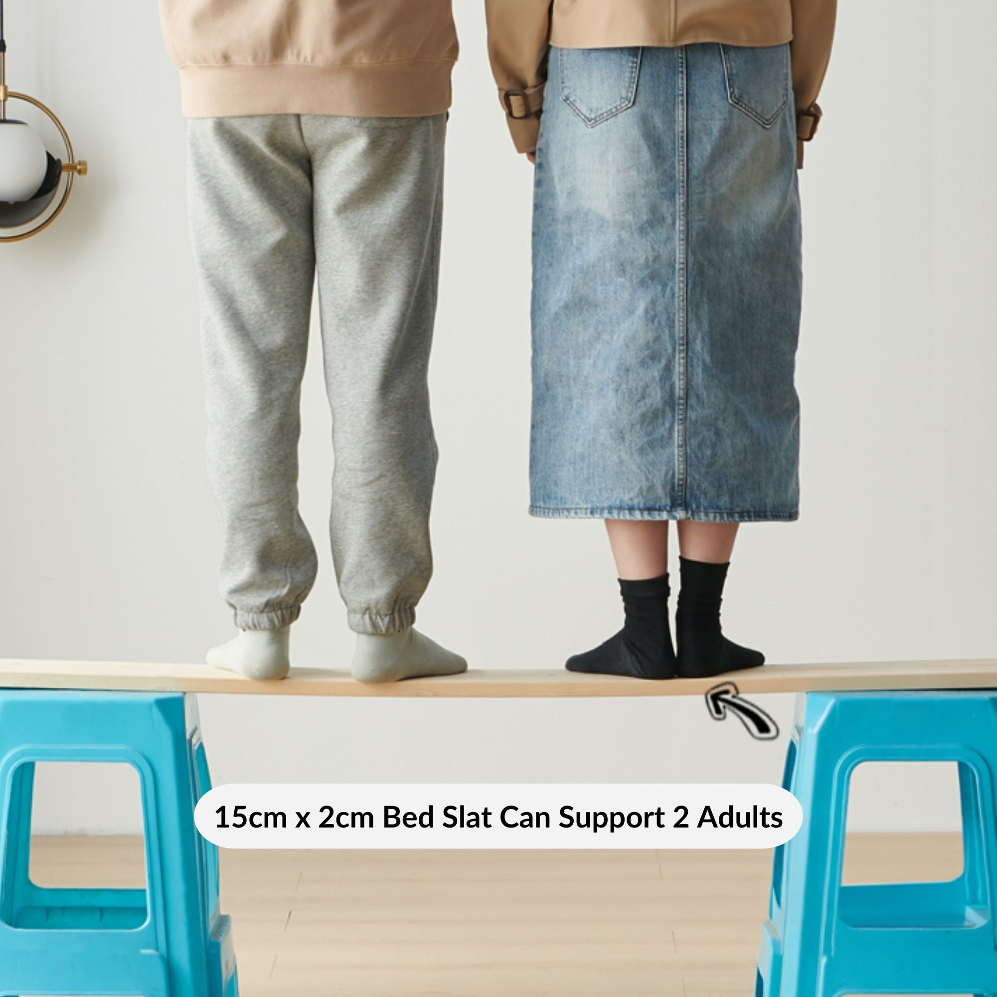 2 adults standing on bed slat