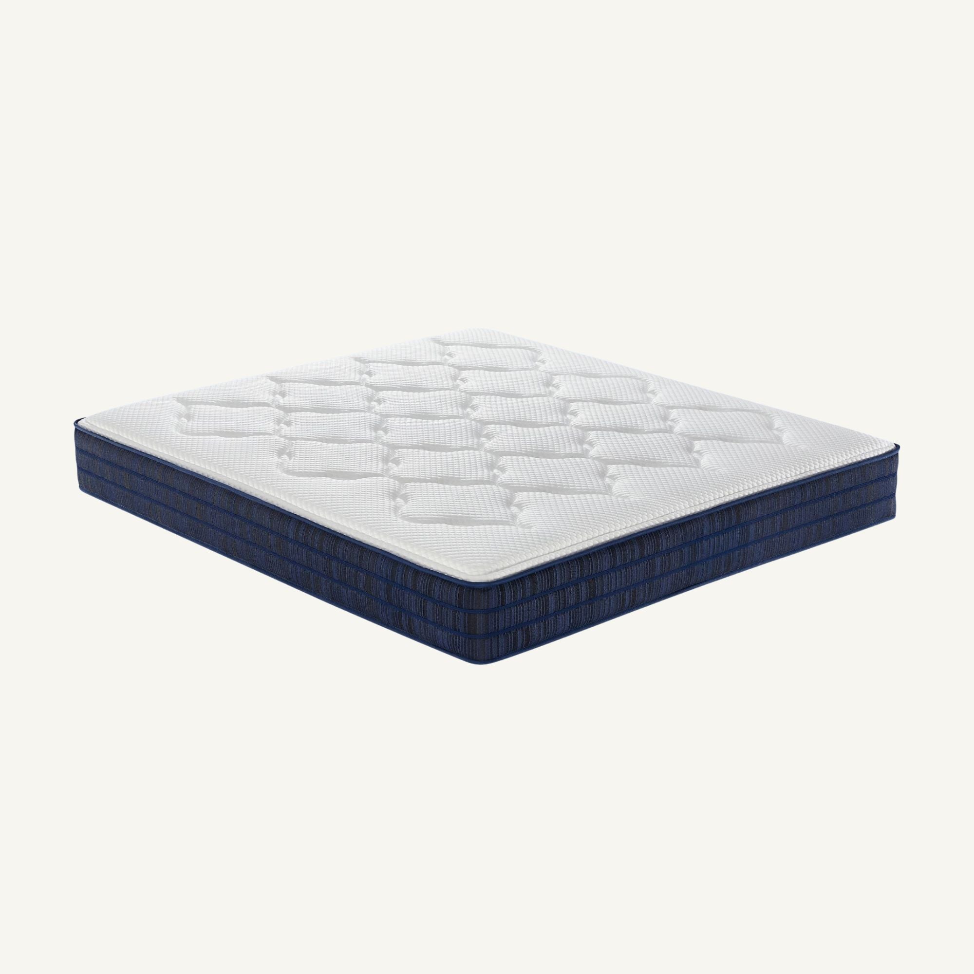 A mattress shown at an angle on a plain light background. The top surface is white with a quilted diamond pattern, and the sides are dark navy blue.
