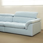 Close-up view of the headrest and armrest on the Calla Sofa