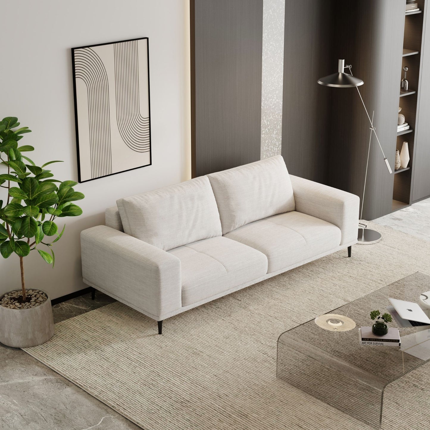 Modern living room with a white sofa, coffee table, and decorative elements.