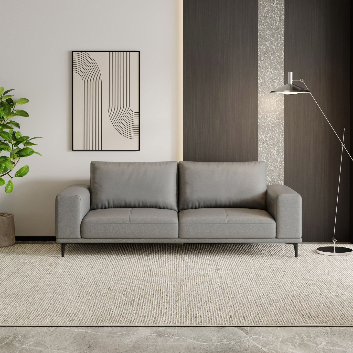 Gray sofa in a modern living room with abstract art and a plant.