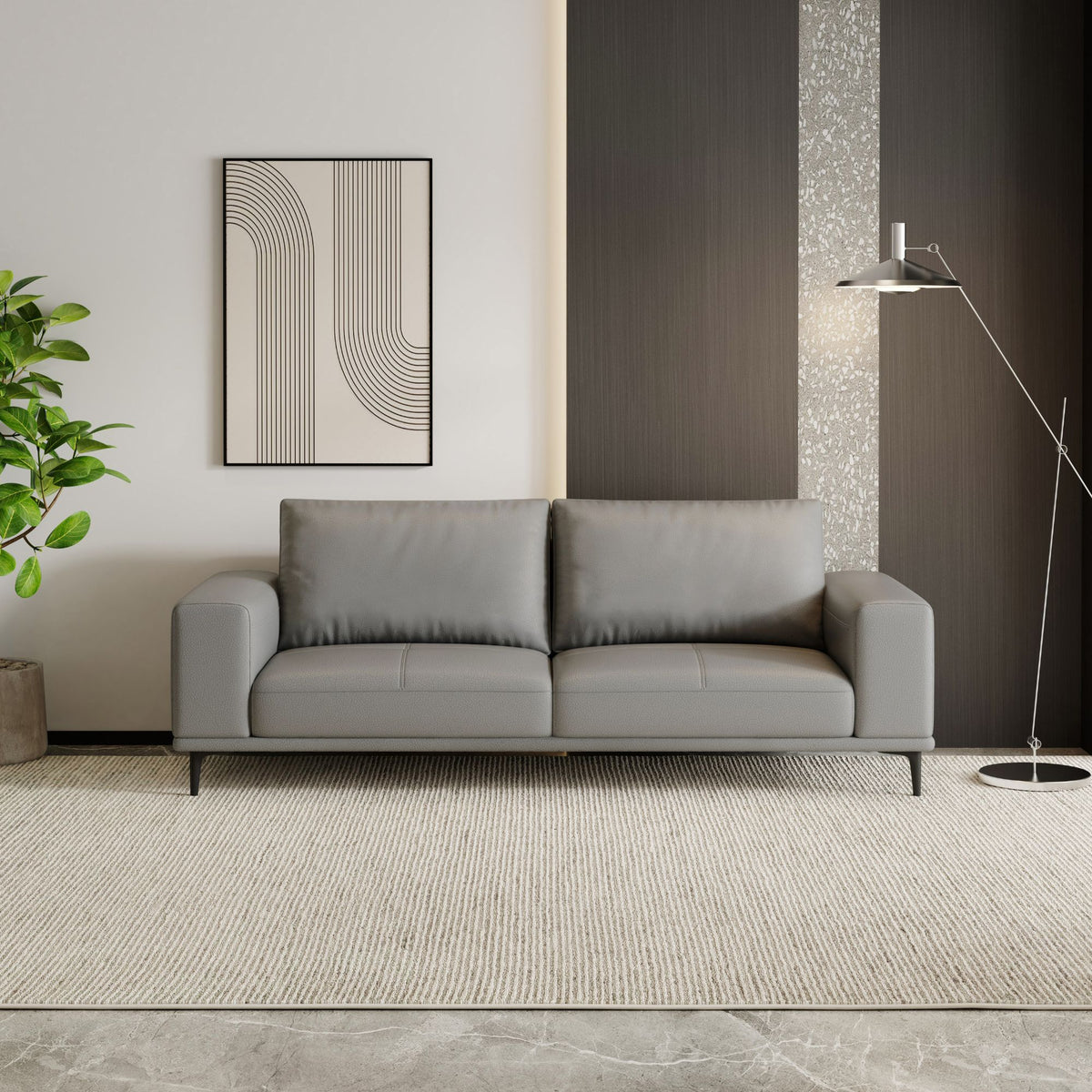 Gray sofa in a modern living room with abstract art and a plant.