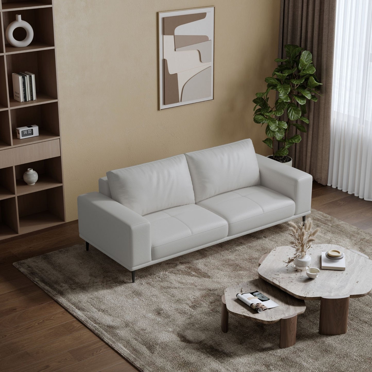 Modern living room with a white sofa, coffee table, and decorative elements.