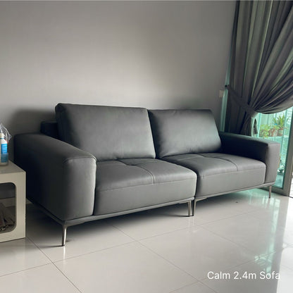 Gray sofa in a room with a neutral color scheme