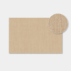 A square beige woven placemat or mat shown on a light gray background, with a circular inset close-up highlighting the textured woven surface.