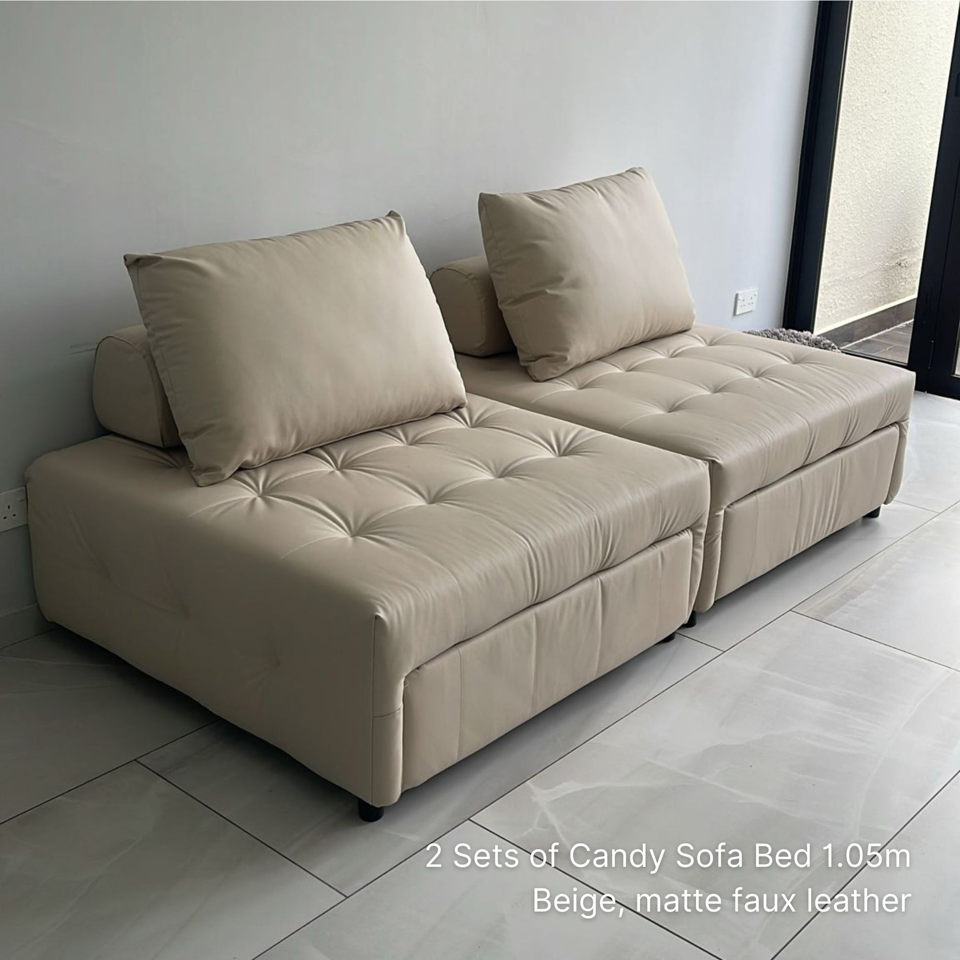 Beige sofa bed with cushions on a tiled floor, text indicating product details.