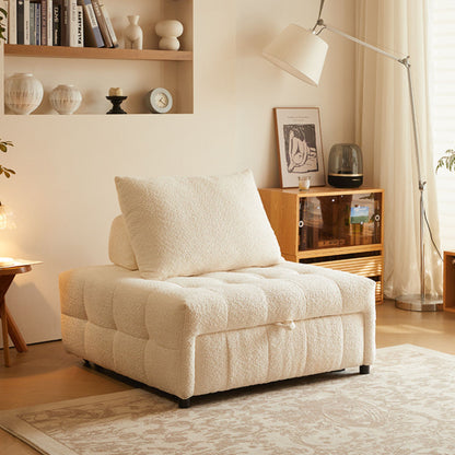 White upholstered sofa bed with a pillow in a cozy living room setting.