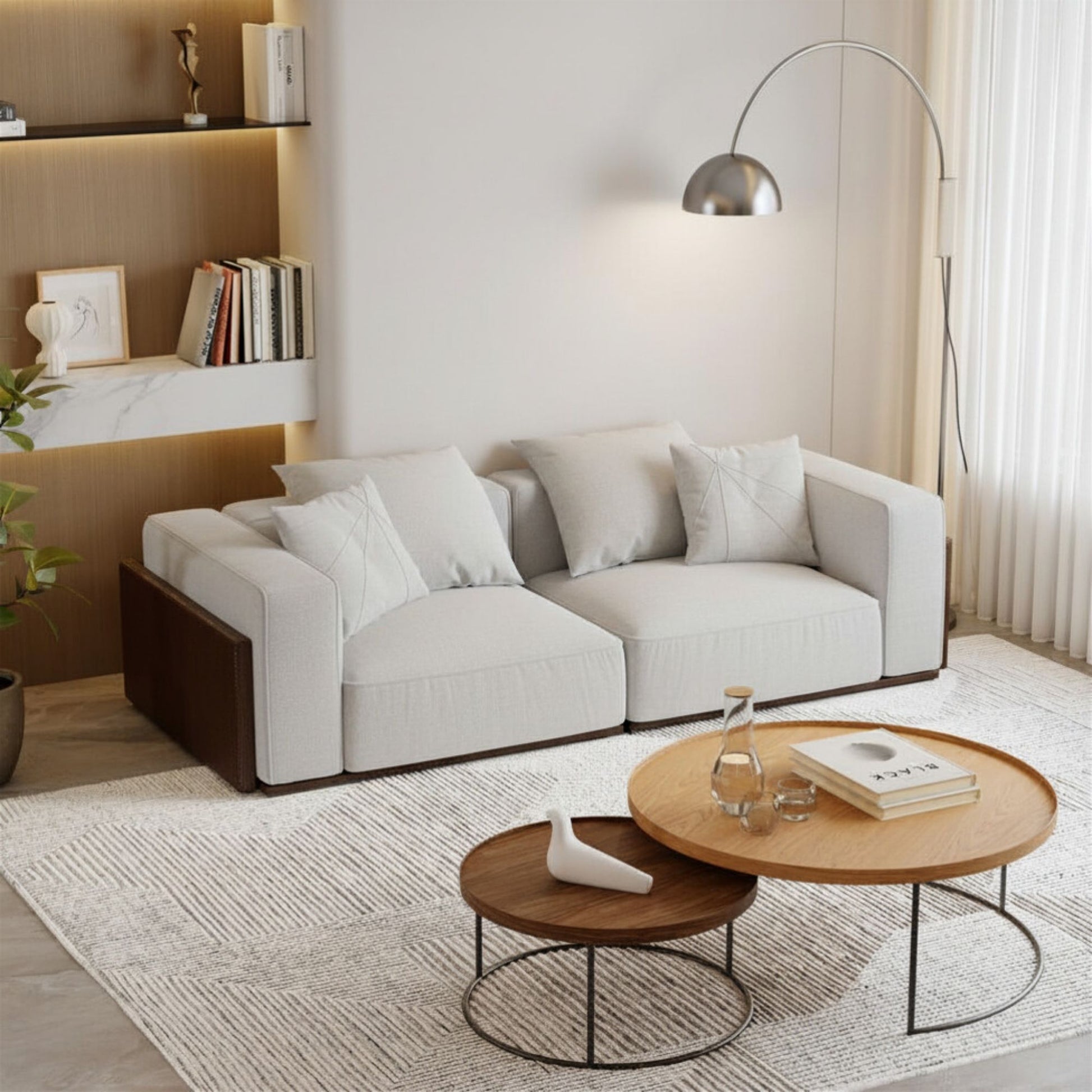 Modern living room with a white sofa, wooden coffee table, and decorative items.