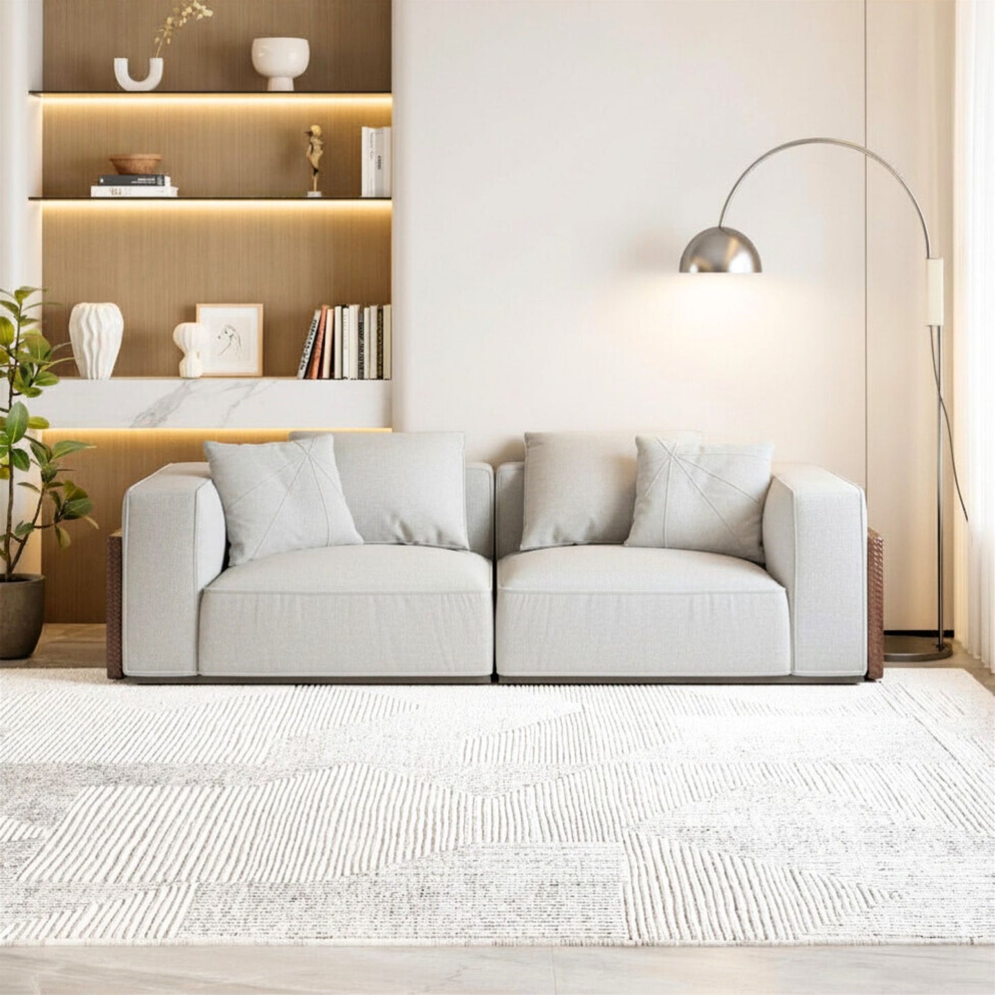 Modern living room with a gray sofa, decorative shelves, and a floor lamp.