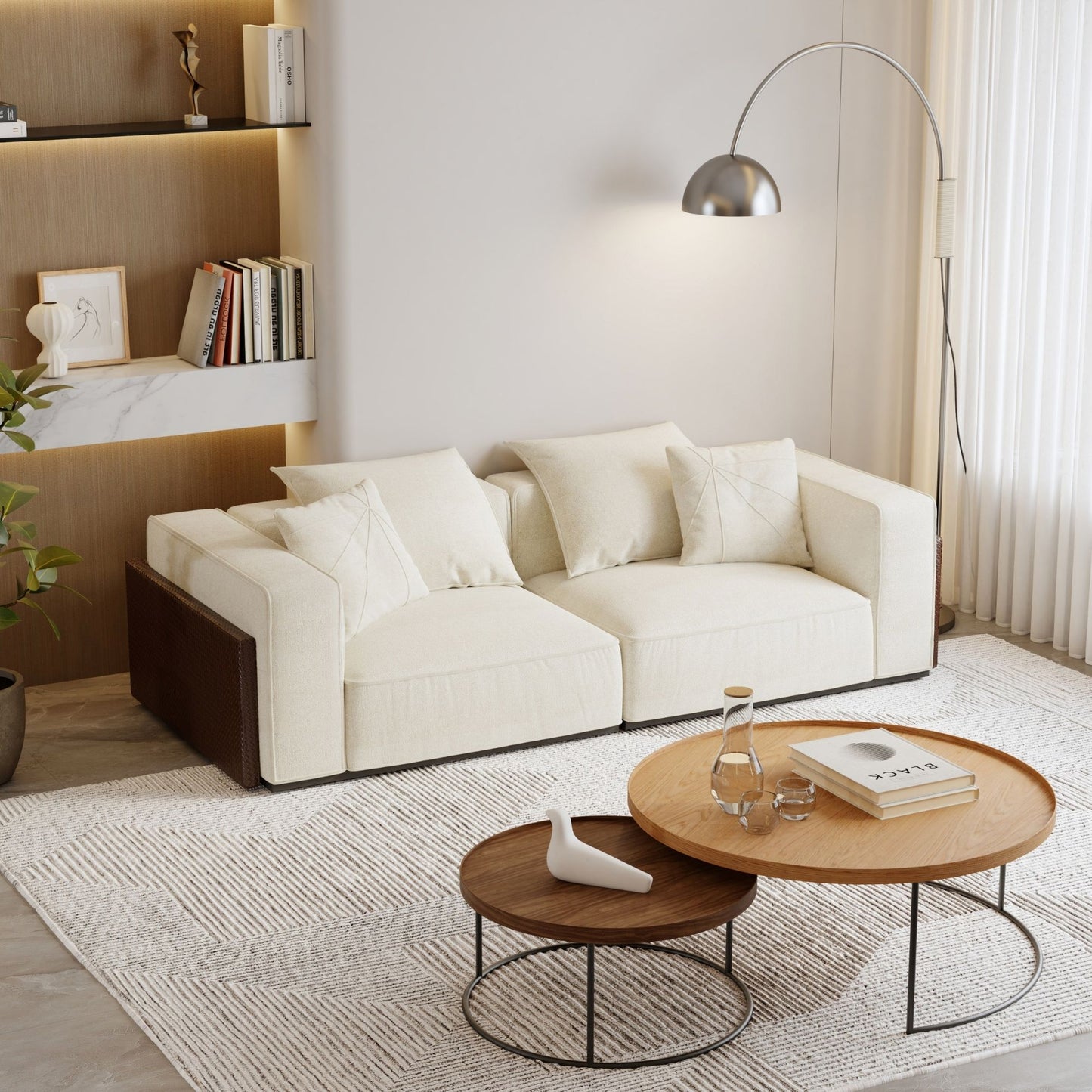 Modern living room with a white sofa, wooden coffee table, and decorative items.