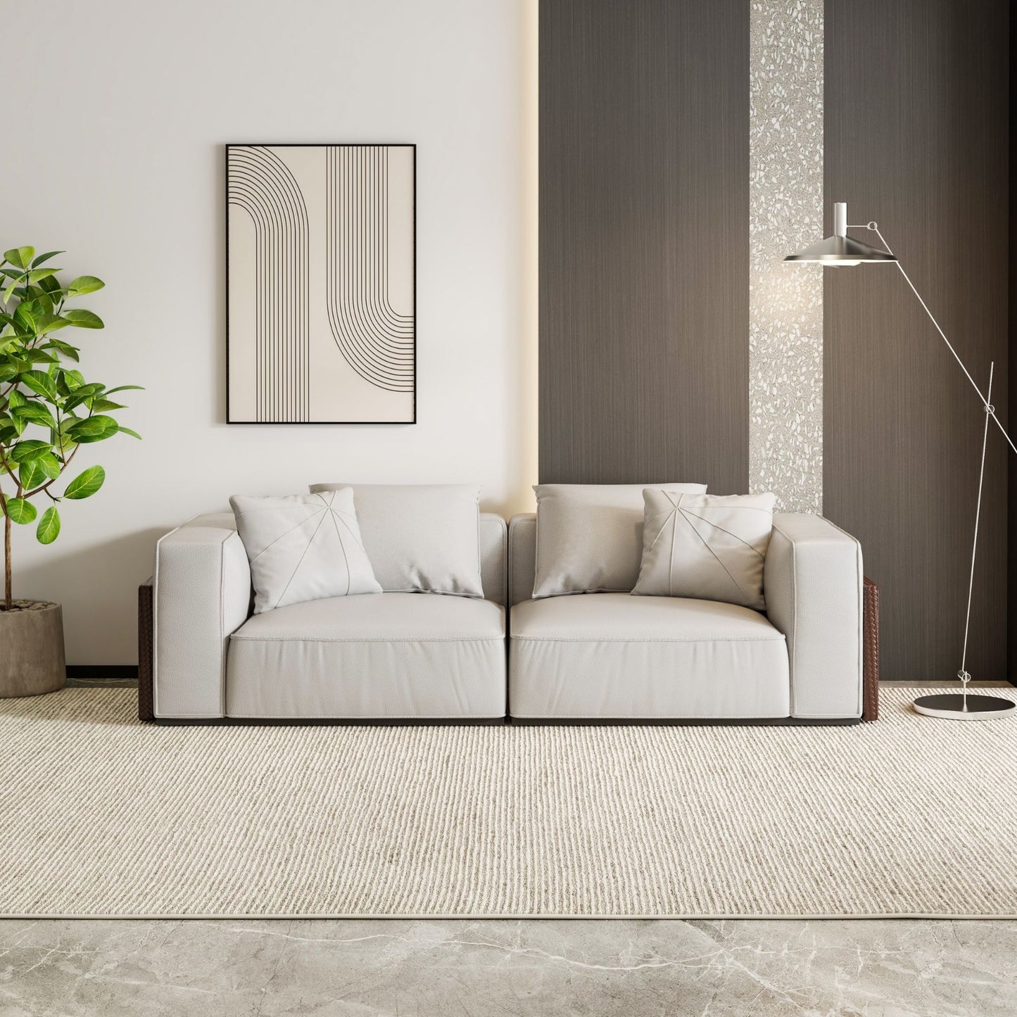 Modern living room with a gray sofa, decorative plant, and wall art.