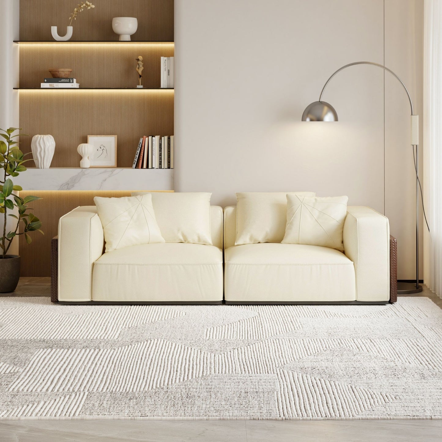 Modern living room with a white sofa, rug, and decorative items.