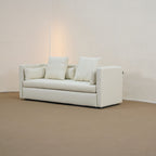 casa white fabric sofa in living room with standing lamp at the back