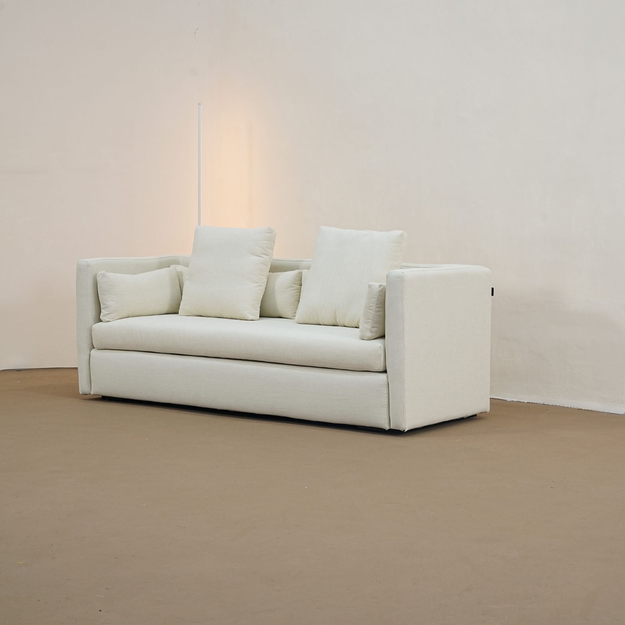 casa white fabric sofa in living room with standing lamp at the back
