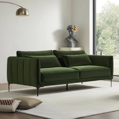 Green sofa in a modern living room with a white wall and window.