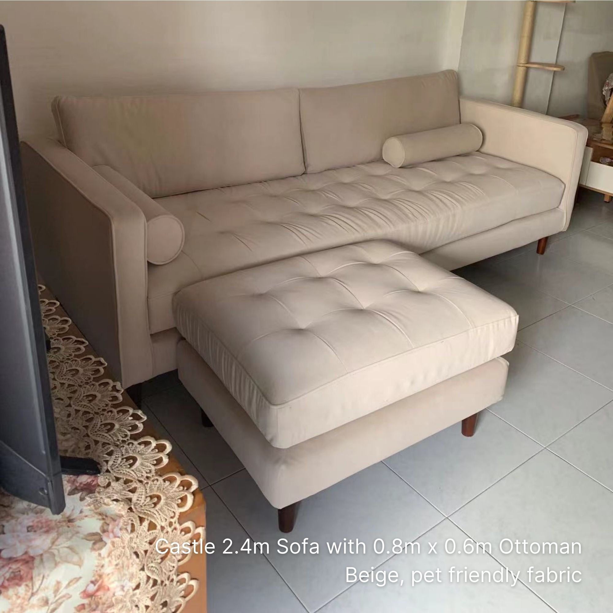 Beige sectional sofa with ottoman in a living room setting