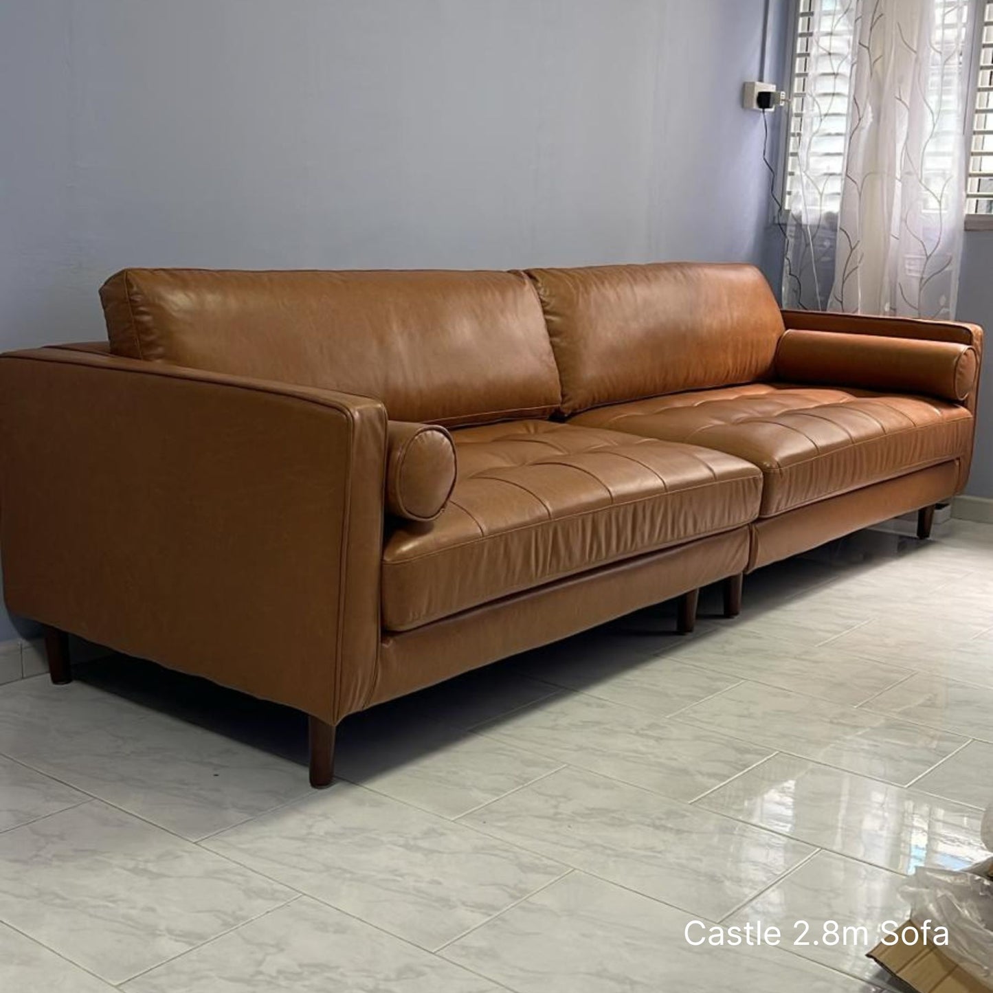 Delivered 4 seater 280cm Castle brown faux leather sofa in customer's living room