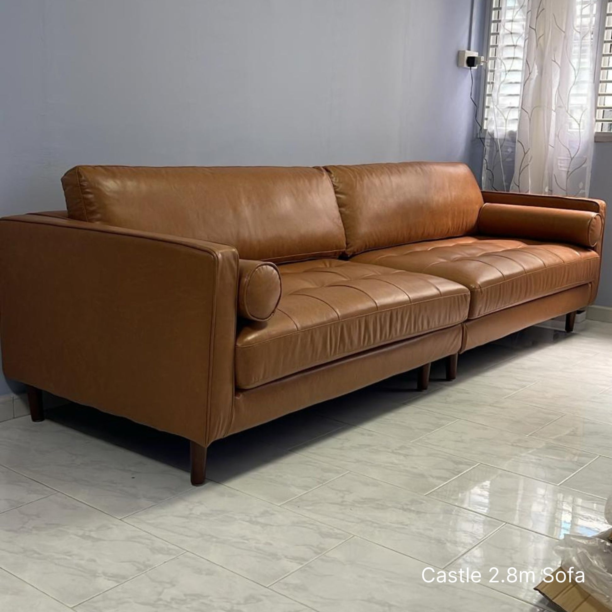 Delivered 4 seater 280cm Castle brown faux leather sofa in customer's living room