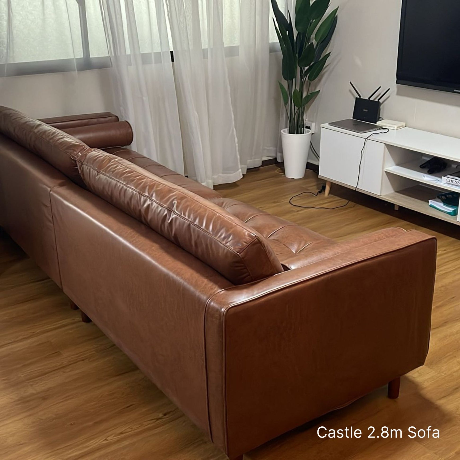 Delivered 4 seater 280cm dark brown faux leather sofa in our customer's living room
