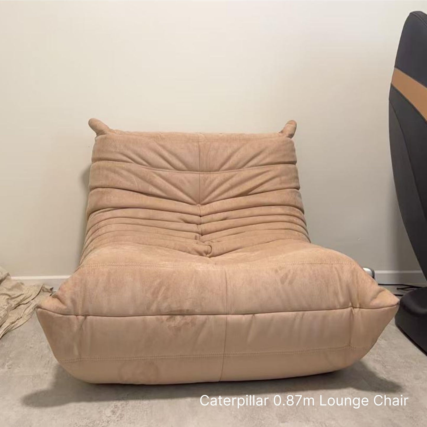 Delivered beige caterpillar lounge chair  to our customer's home next to a massage chair