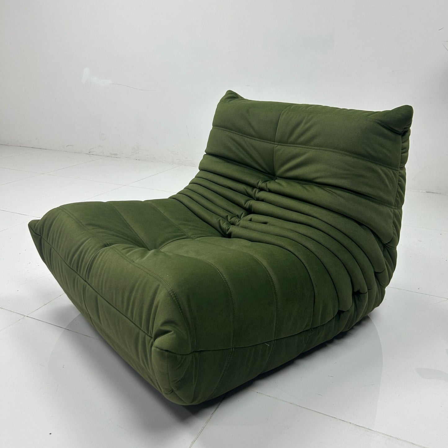 Caterpillar green lounge chair on the factory floor