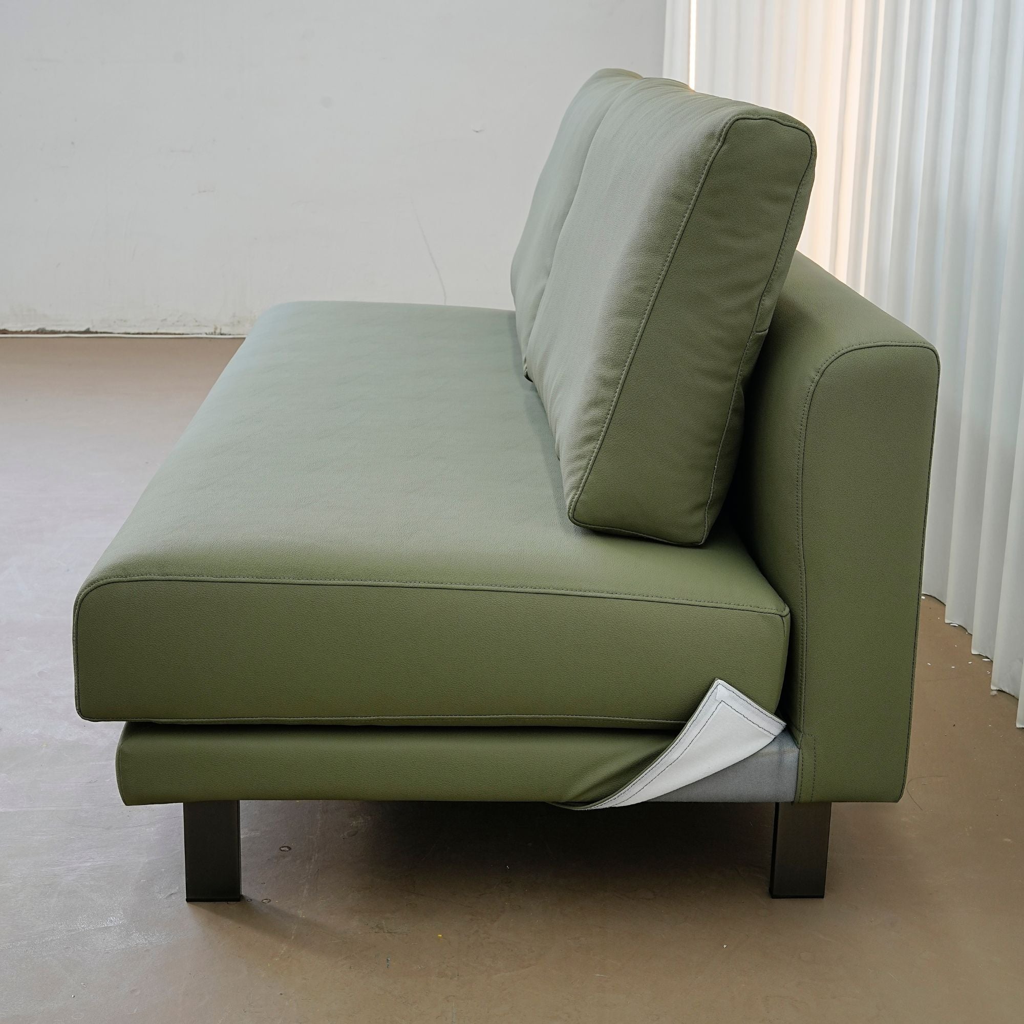Cedar green faux leather armless sofa