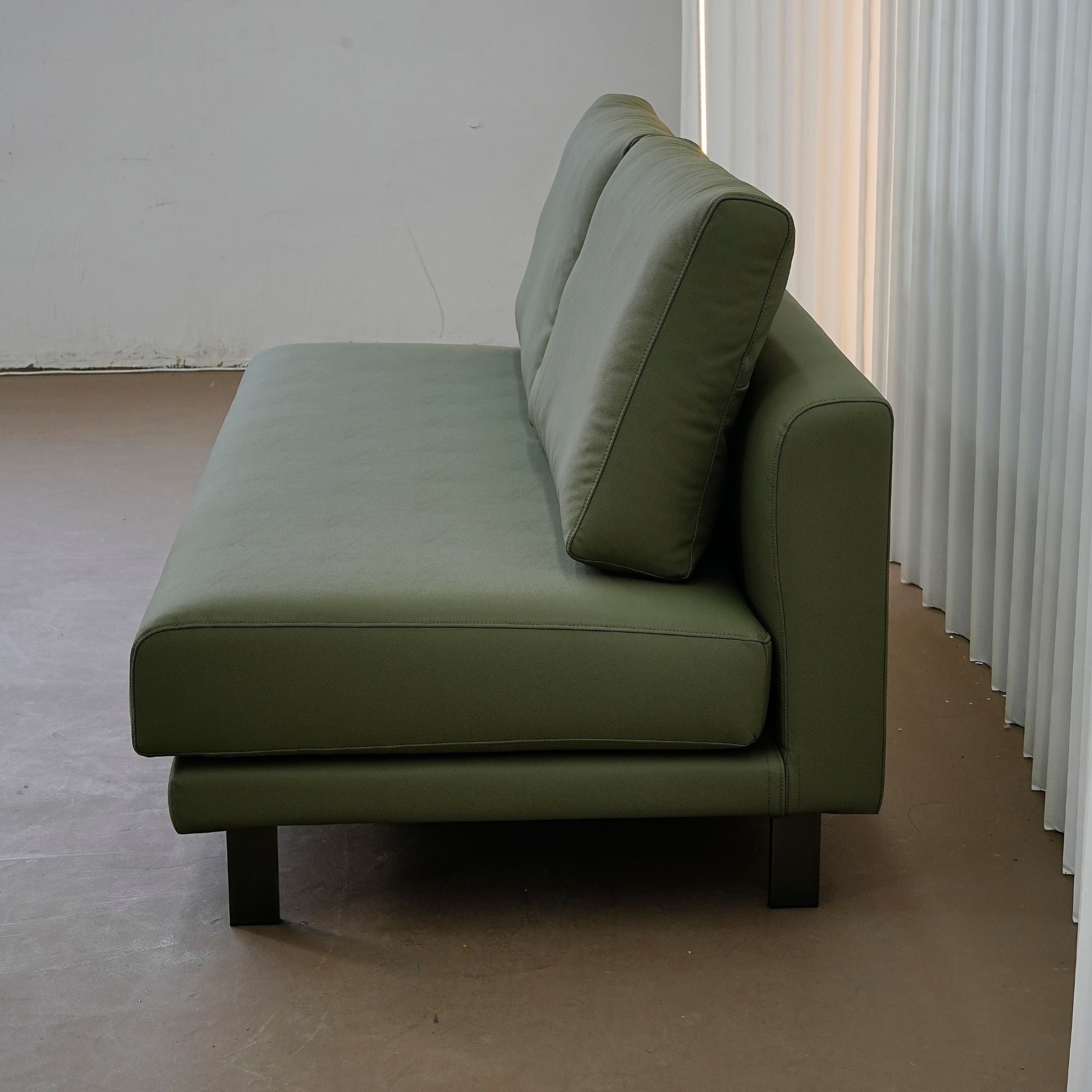 Cedar green faux leather armless sofa