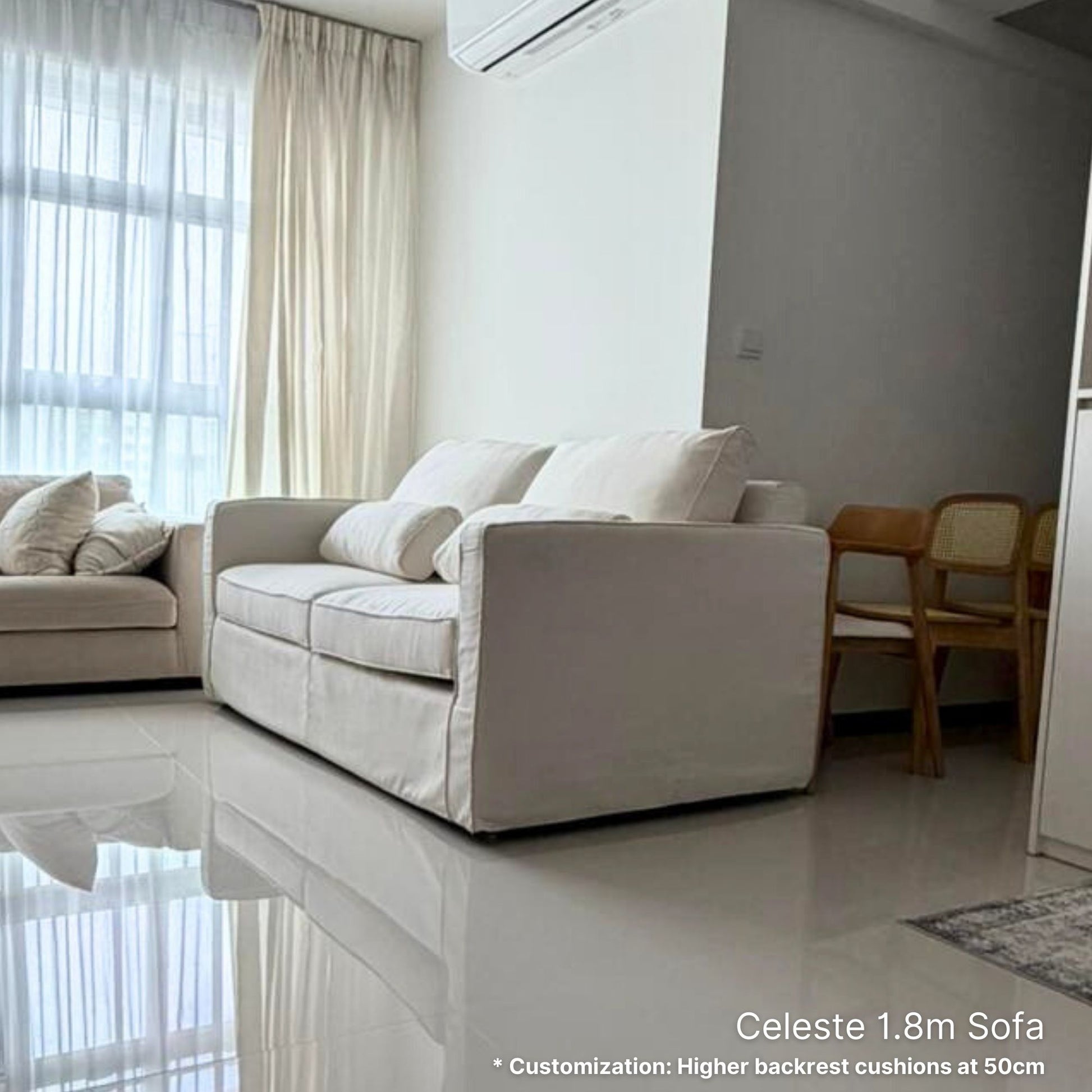 White 2 seater 180cm Celeste fabric sofa in a modern living room with light-colored walls and floor.