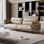 Beige sofa in a modern living room with a bookshelf in the background