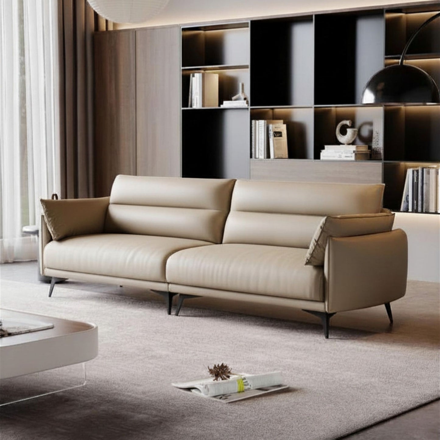 Beige sofa in a modern living room with a bookshelf in the background