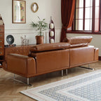 Brown leather sofa in a living room with decorative elements.