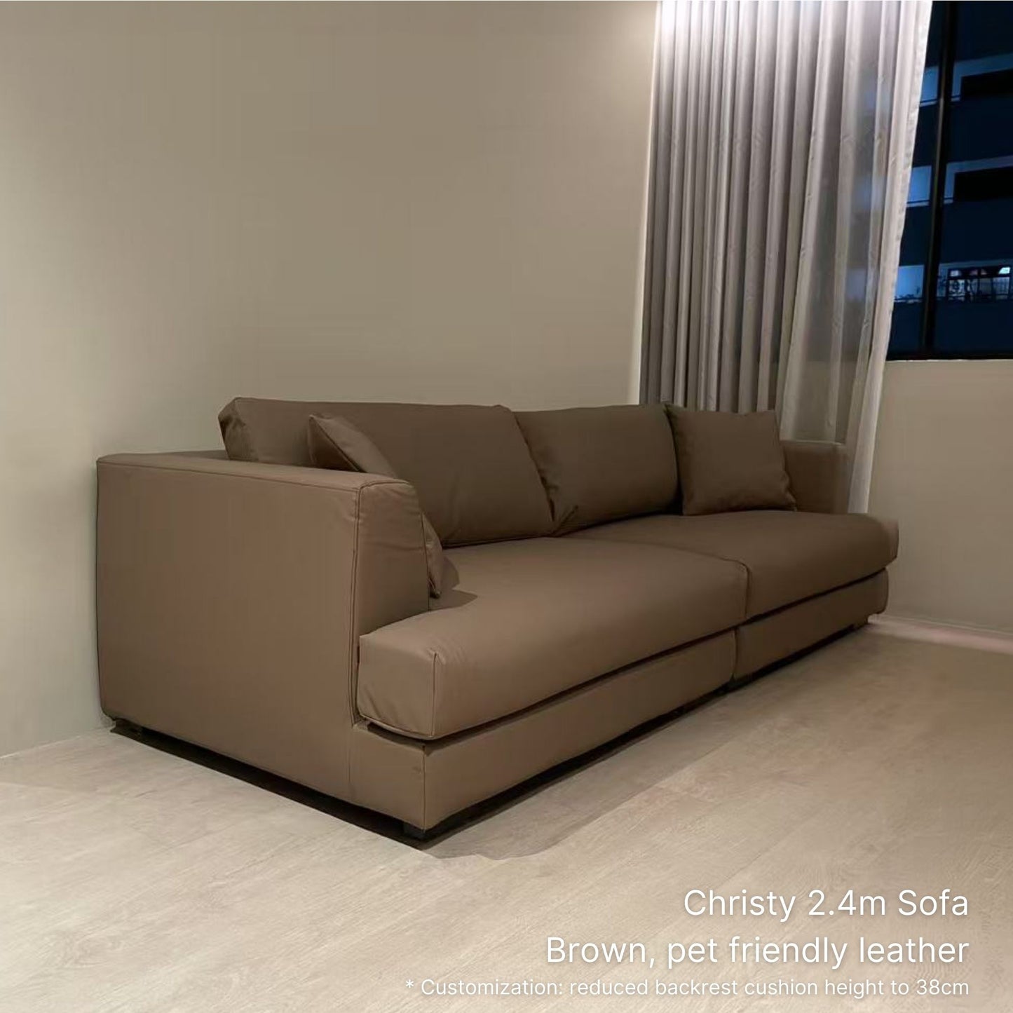 3 seater 240cm brown pet friendly leather Christy sofa in a room with beige walls and a window.