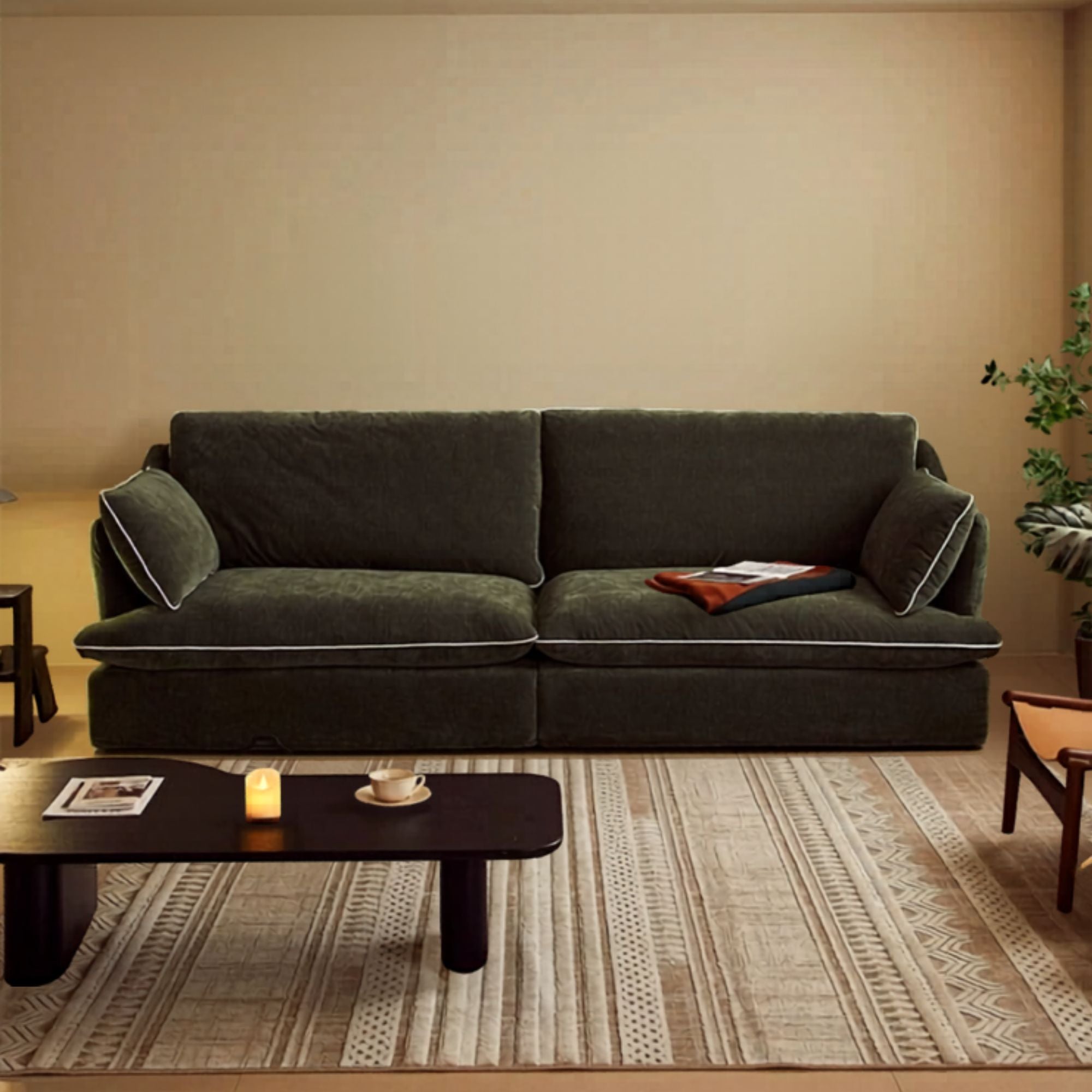 Green sofa in a living room with a coffee table and decorative items.