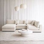 Claudia fabric u shaped sofa in default white in office setting with left chaise