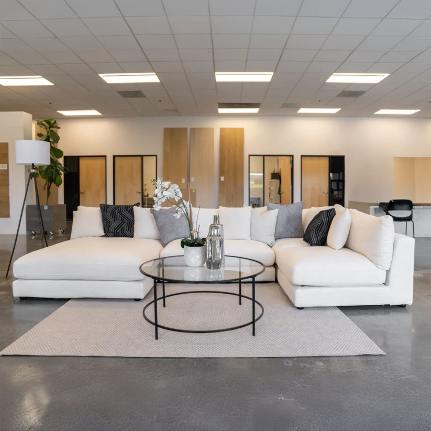 Claudia fabric u shaped sofa in default white in office setting with left chaise