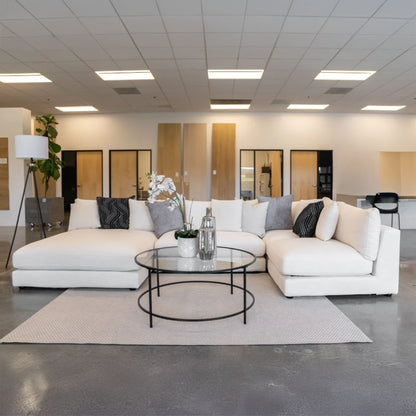 Claudia fabric u shaped sofa in default white in office setting with left chaise