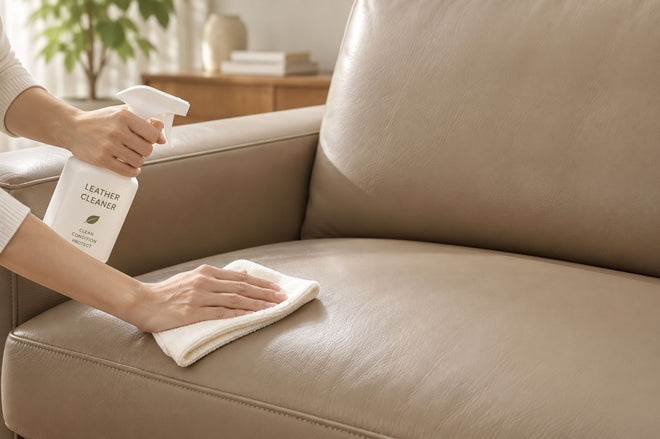 Cleaning leather sofa upholstery with a soft cloth