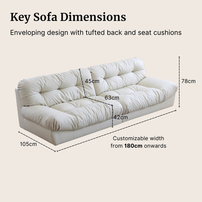 White sofa with dimensions labeled on a beige background