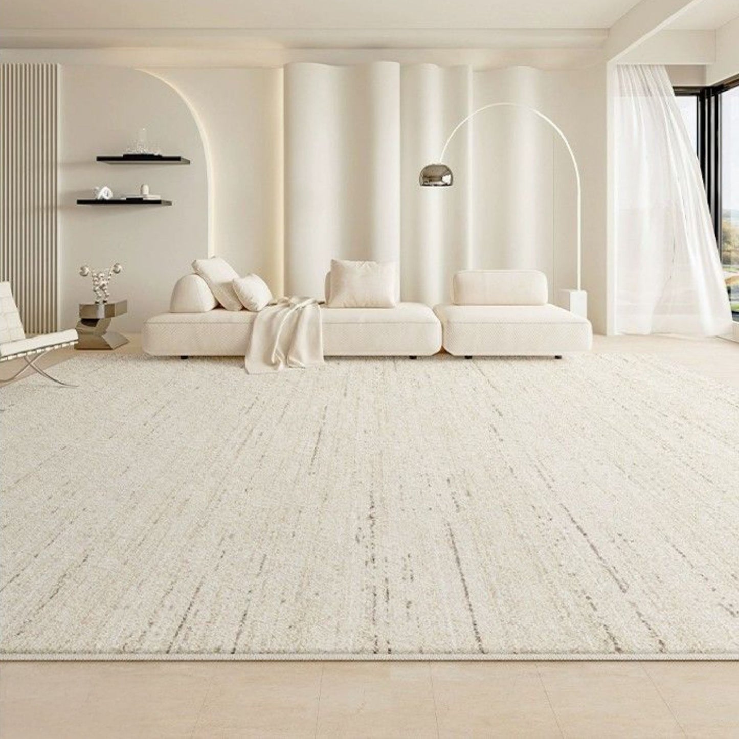 Modern living room with a white sofa and decorative elements.