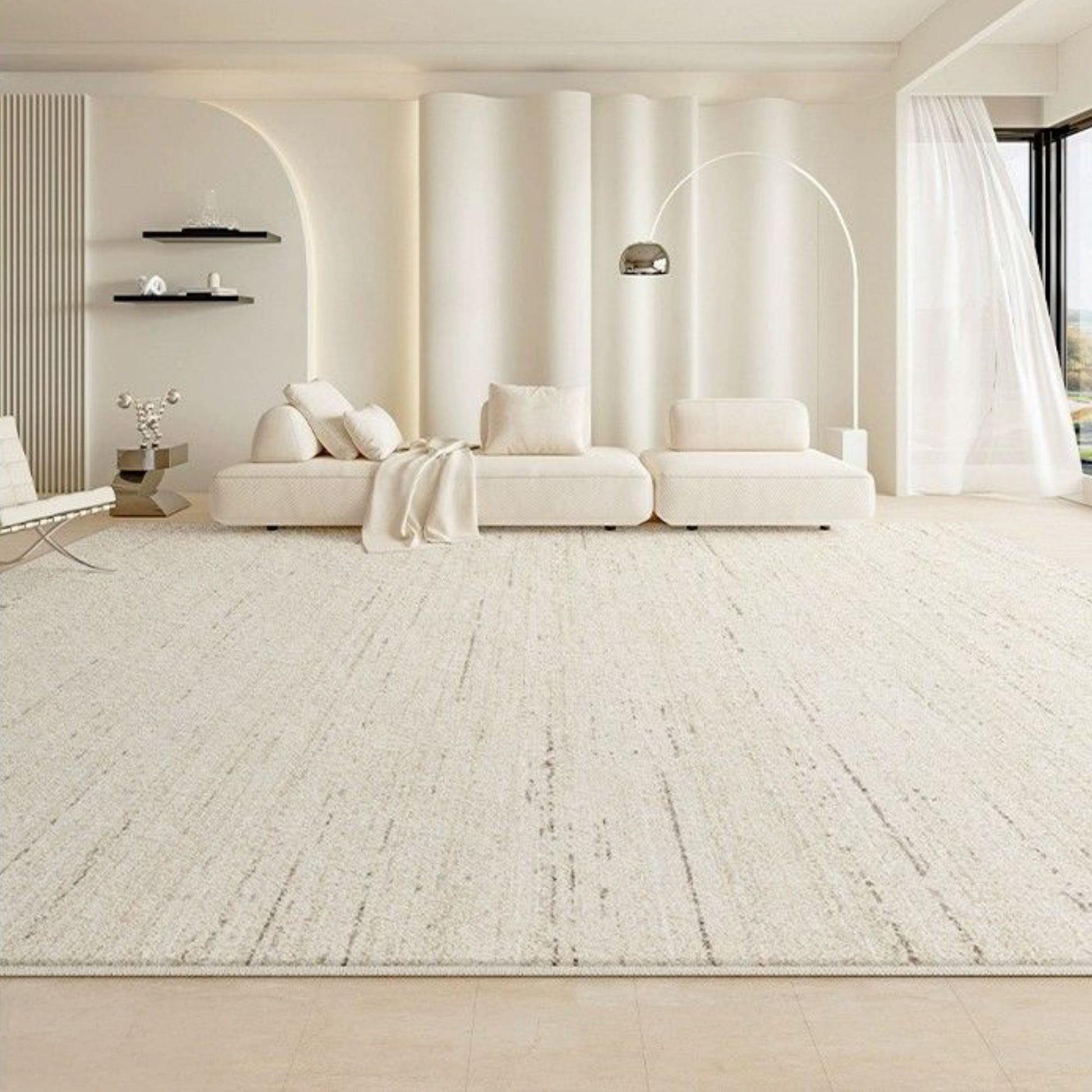 Modern living room with a white sofa and decorative elements.
